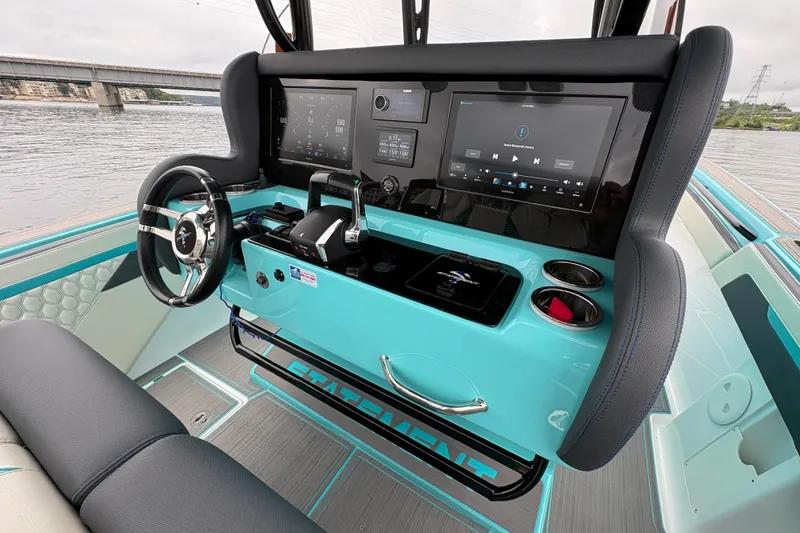 Slide: The Image of 2017 Statement 380 Open boat cockpit with modern controls and turquoise accents. - 5