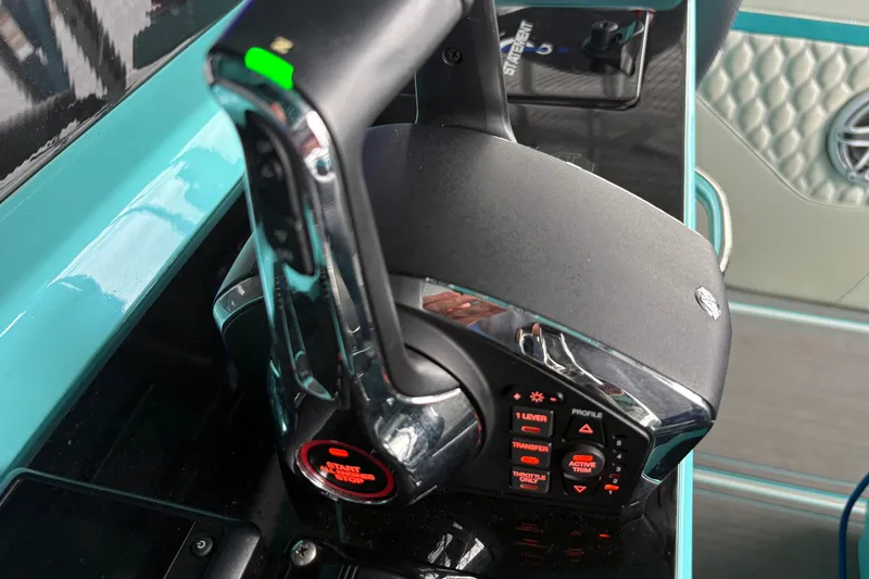 Slide: The Image of Control panel of a 2017 Statement 380 Open boat with throttle and start/stop button. - 20