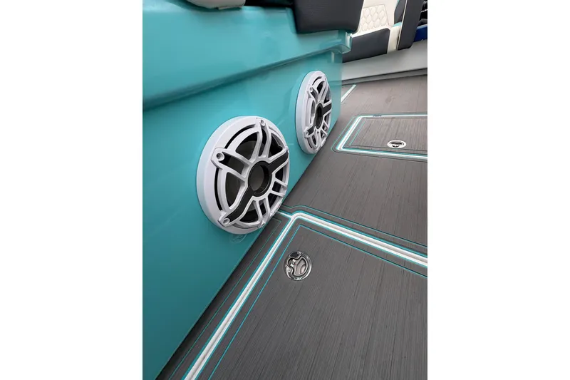 Slide: The Image of 2017 Statement 380 Open boat interior with teal accents and modern speaker system. - 28
