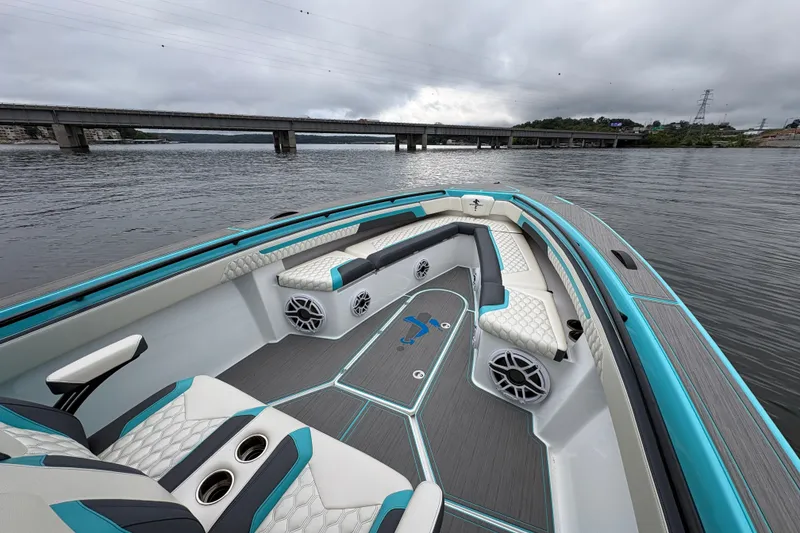 Slide: The Image of Luxurious 2017 Statement 380 Open boat interior with stylish seating on a calm river. - 10