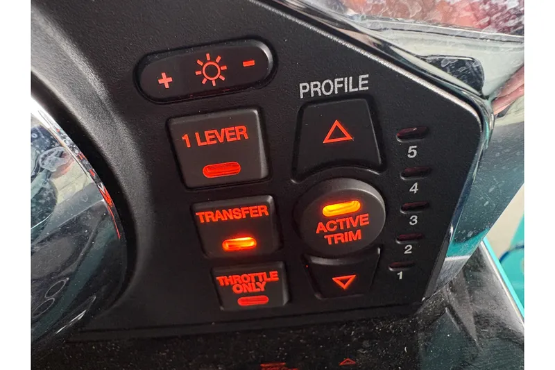 Slide: The Image of Control panel of a 2017 Statement 380 Open boat with illuminated buttons. - 22