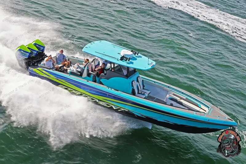 Slide: The Image of 2017 Statement 380 Open boat speeding on water with passengers, vibrant blue and green design. - 1