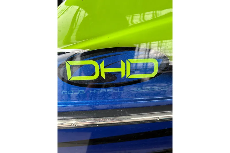 Slide: The Image of Close-up of Doug Harrell Designs (DHD) logo on a 2017 Statement 380 Open boat. - 37