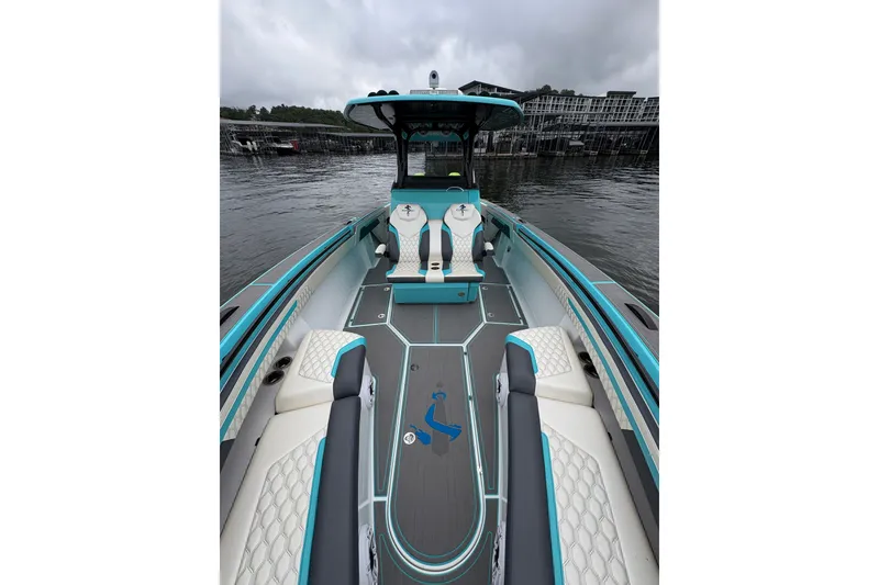 Slide: The Image of 2017 Statement 380 Open boat with sleek design, turquoise accents, and comfortable seating on the water. - 11