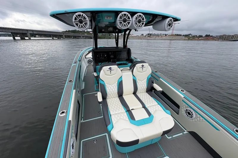Slide: The Image of 2017 Statement 380 Open boat interior with stylish seating and advanced audio system on the water. - 13
