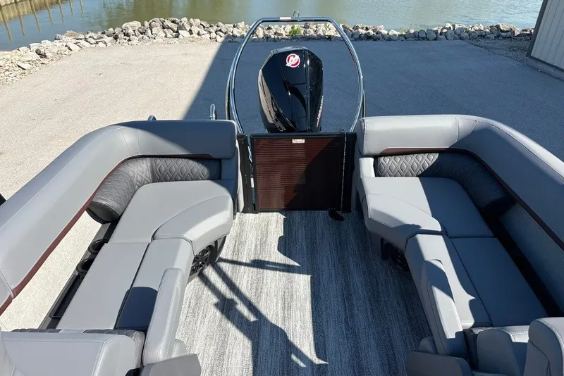 Slide: The Image of 2027 Bennington 22 M Open Fastback Quad Bench with luxurious seating by the water. - 9