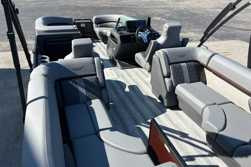 Slide: The Image of 2027 Bennington 22 M Open Fastback Quad Bench interior with luxurious seating and modern design. - 12