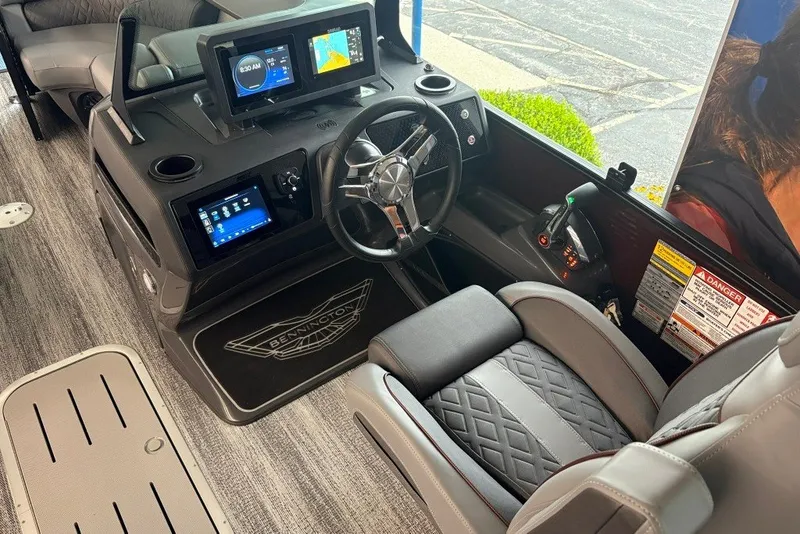 Slide: The Image of Interior of 2027 Bennington 22 M Open Fastback Quad Bench with modern dashboard and controls. - 17