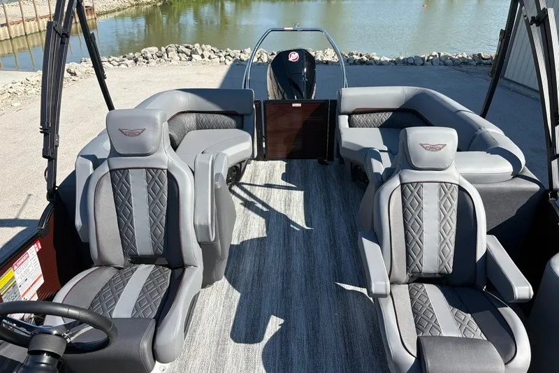 Slide: The Image of 2027 Bennington 22 M Open Fastback Quad Bench interior with luxurious seating by the water. - 13