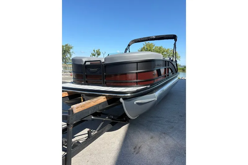 Slide: The Image of 2027 Bennington 22 M Open Fastback Quad Bench pontoon boat on trailer. - 7