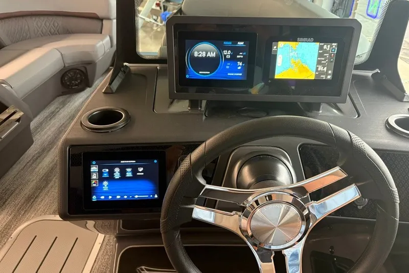 Slide: The Image of 2027 Bennington 22 M Open Fastback Quad Bench dashboard with modern navigation displays. - 15