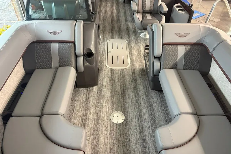 Slide: The Image of 2027 Bennington 22 M Open Fastback Quad Bench interior with luxurious seating and modern design. - 16