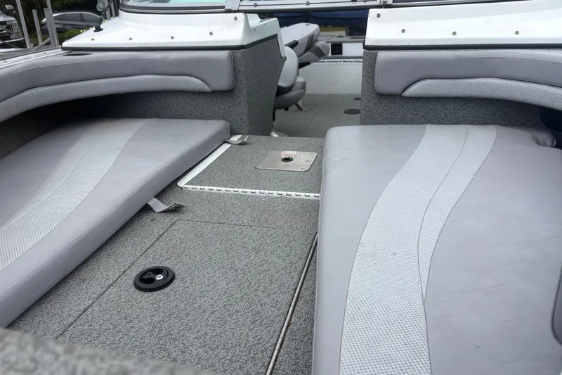 Slide: The Image of Interior view of a 2012 Polar Kraft Kodiak 180 WT boat with gray seating and carpet. - 5