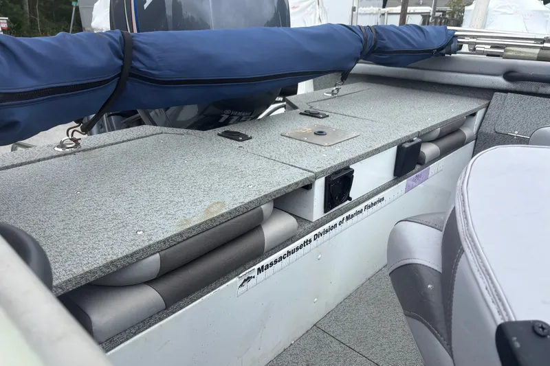 Slide: The Image of 2012 Polar Kraft Kodiak 180 WT boat interior with storage compartments and seating. - 10
