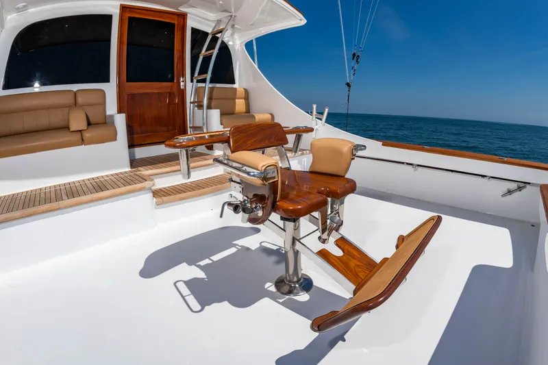 Slide: The Image of The image shows the cockpit of a 2004 Custom Carolina 61' Sportfisherman with luxurious seating. - 9