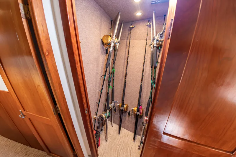 Slide: The Image of Fishing rods stored in a closet on a sportfisherman boat. - 43