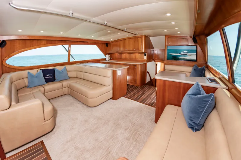 Slide: The Image of Luxurious interior of a 2004 Custom Carolina 61' Sportfisherman with comfortable sofas and ocean view. - 22