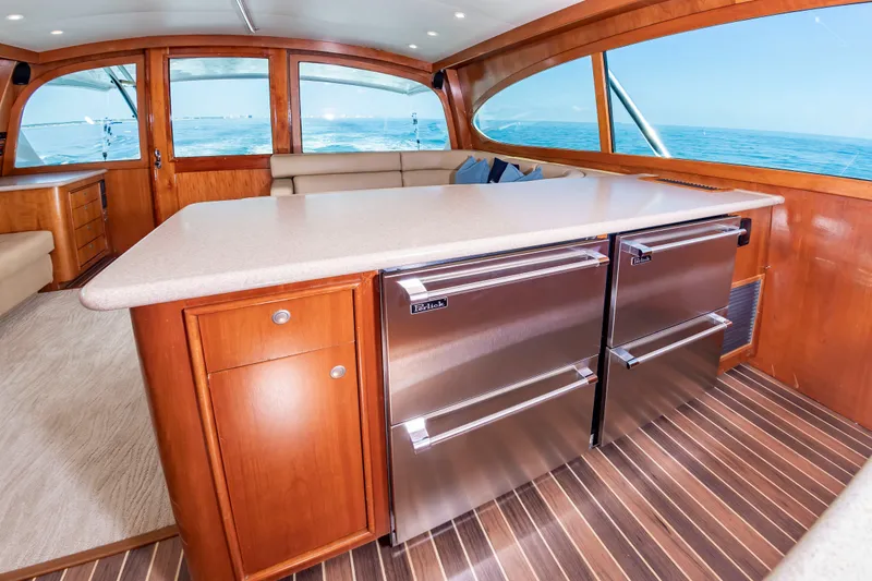 Slide: The Image of Interior of a 2004 Custom Carolina 61' Sportfisherman with sleek kitchen and ocean view. - 29