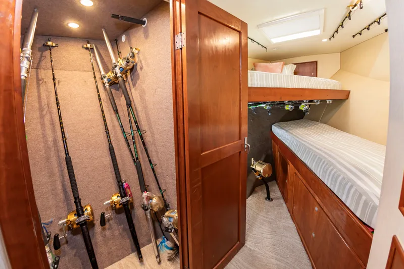 Slide: The Image of Interior of a sportfisherman yacht with fishing rod storage and bunk beds. - 42