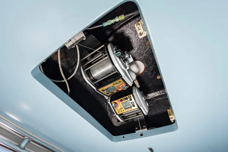 Slide: The Image of An electric fishing reel system is installed in the ceiling of a boat. - 21