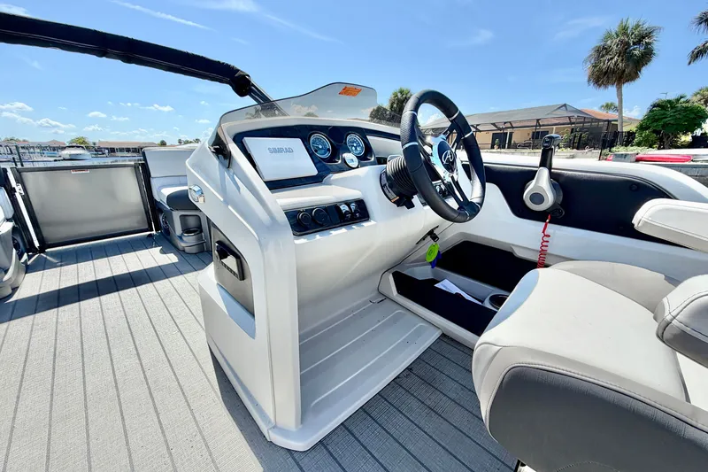 Slide: The Image of 2023 Avalon 2385 LSZ boat interior with steering wheel and dashboard controls. - 15