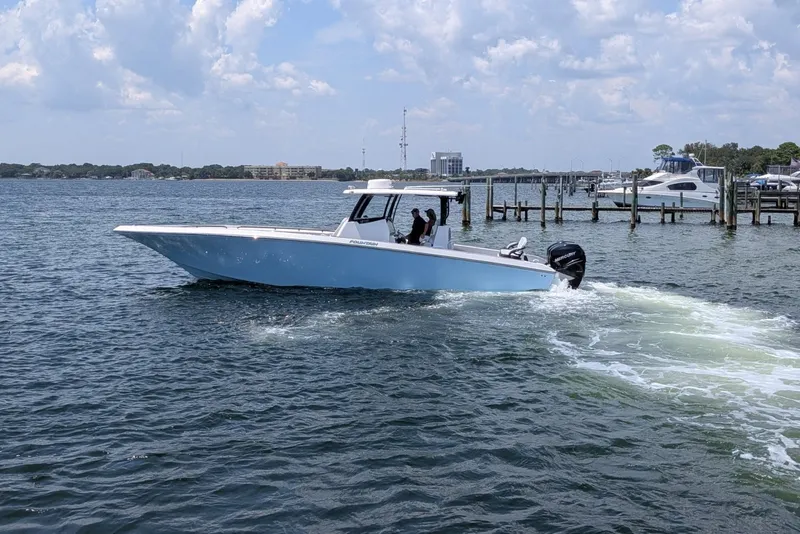 Slide: The Image of 2023 Fountain Bluewater 38 Tournament Edition boat cruising on a sunny day. - 4