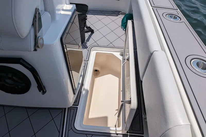 Slide: The Image of 2023 Fountain Bluewater 38 Tournament Edition boat interior with open storage compartment. - 14