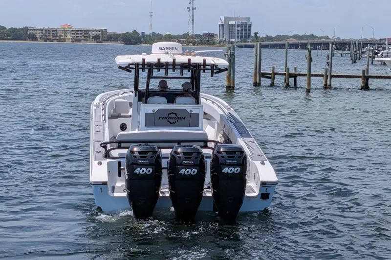 Slide: The Image of 2023 Fountain Bluewater 38 Tournament Edition boat with triple 400 horsepower engines on water. - 6