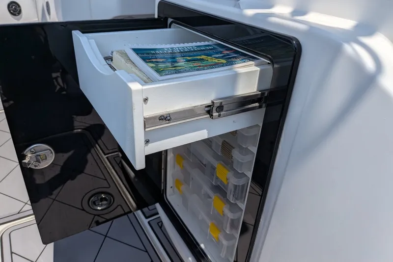 Slide: The Image of Open tackle storage drawer on 2023 Fountain Bluewater 38 Tournament Edition boat. - 19