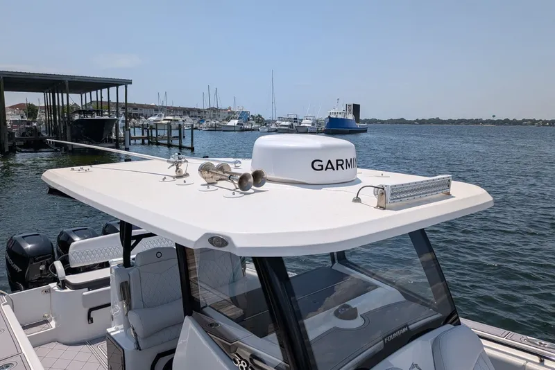 Slide: The Image of 2023 Fountain Bluewater 38 Tournament Edition boat docked with Garmin equipment. - 21