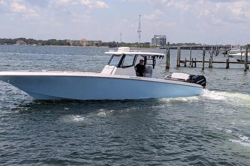 Slide: The Image of 2023 Fountain Bluewater 38 Tournament Edition boat cruising on a sunny day. - 2