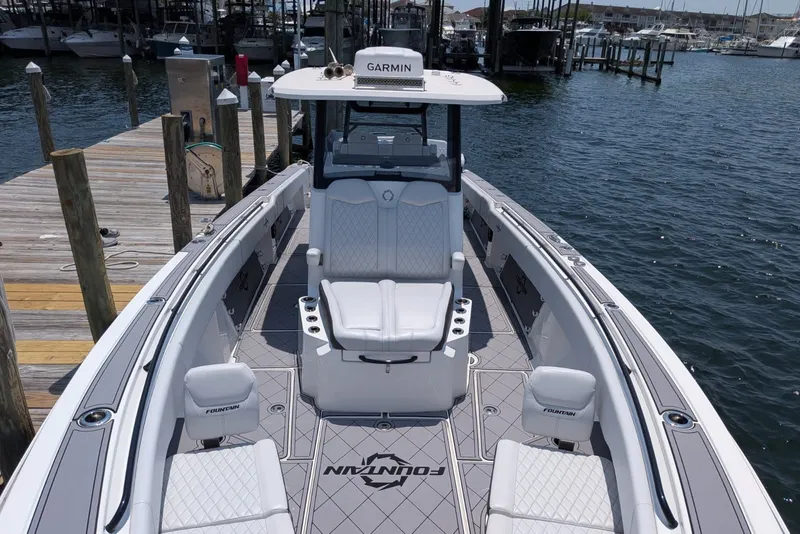 Slide: The Image of 2023 Fountain Bluewater 38 Tournament Edition boat docked at marina. - 7