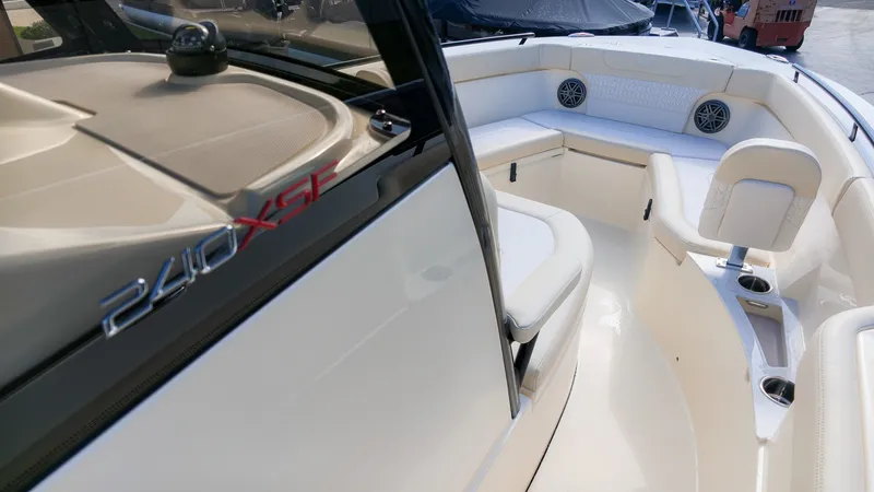 Slide: The Image of The image shows the cockpit of a 2027 Scout 240 XSF boat with sleek seating and speakers. - 14