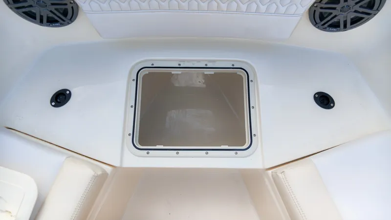 Slide: The Image of A white boat cooler with a transparent lid, surrounded by speakers. - 17