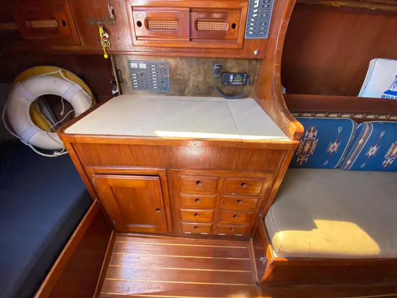 Slide: The Image of 1978 Sailboat MSY 38 interior with wooden cabinetry and navigation station. - 21