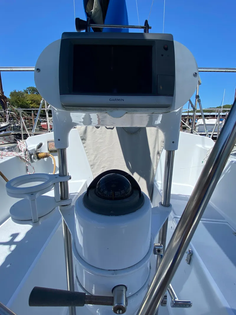 Slide: The Image of Alt text: 1978 Sailboat MSY 38 cockpit with navigation equipment and compass. - 11