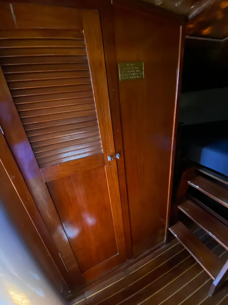 Slide: The Image of 1978 Sailboat MSY 38 interior with wooden closet and steps. - 29