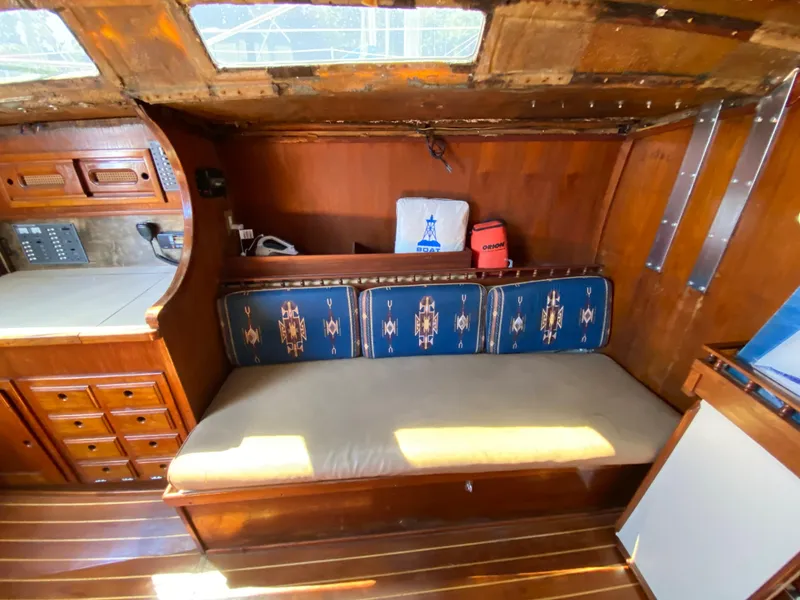 Slide: The Image of 1978 Sailboat MSY 38 interior with wooden cabinetry and cushioned seating. - 22