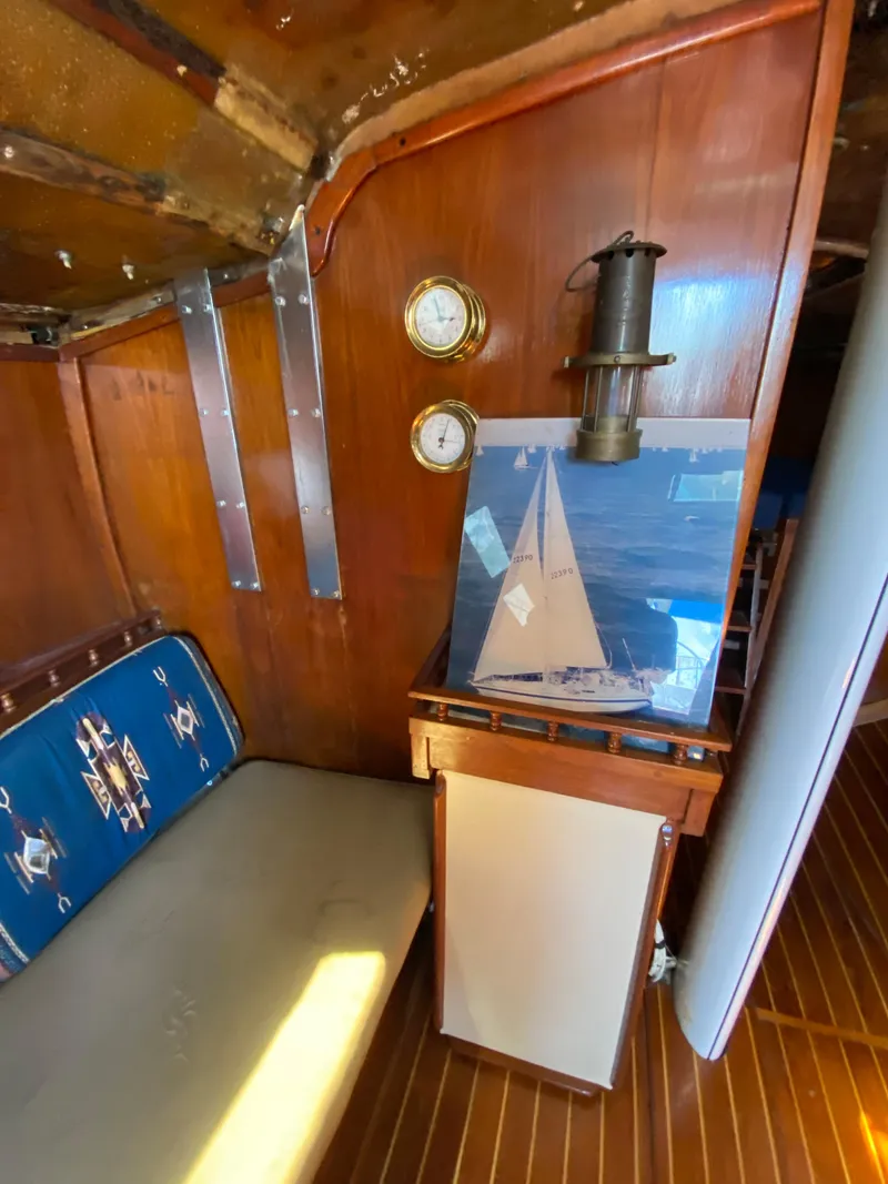 Slide: The Image of Interior of a 1978 Sailboat MSY 38 with nautical decor and wooden finishes. - 23