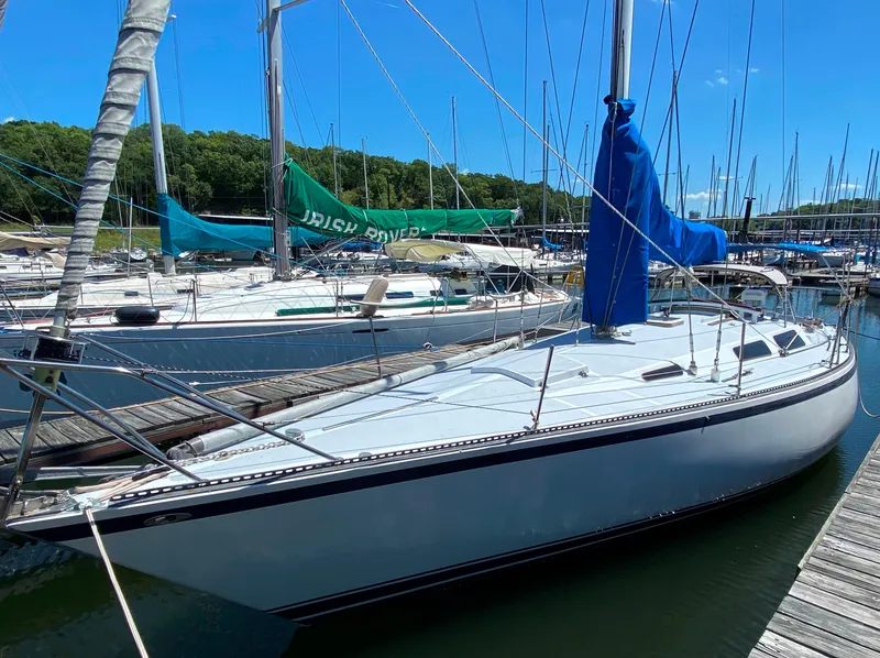 Slide: The Image of 1978 Sailboat MSY 38 docked at marina on a sunny day. - 1