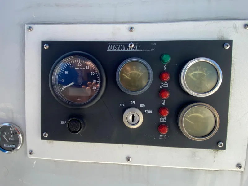 Slide: The Image of Control panel of a 1978 MSY 38 sailboat with gauges and indicators. - 12