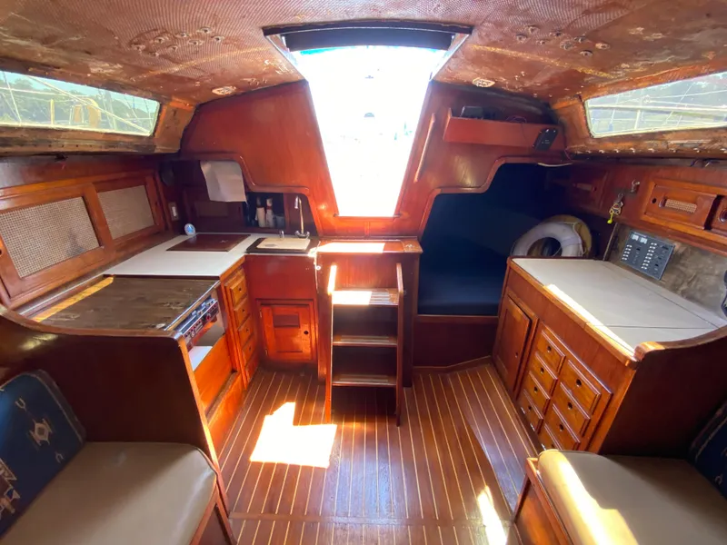 Slide: The Image of Interior of a 1978 Sailboat MSY 38 with wooden cabinetry and seating. - 19