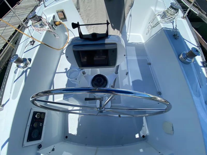 Slide: The Image of Cockpit of a 1978 MSY 38 sailboat with steering wheel and navigation equipment. - 14