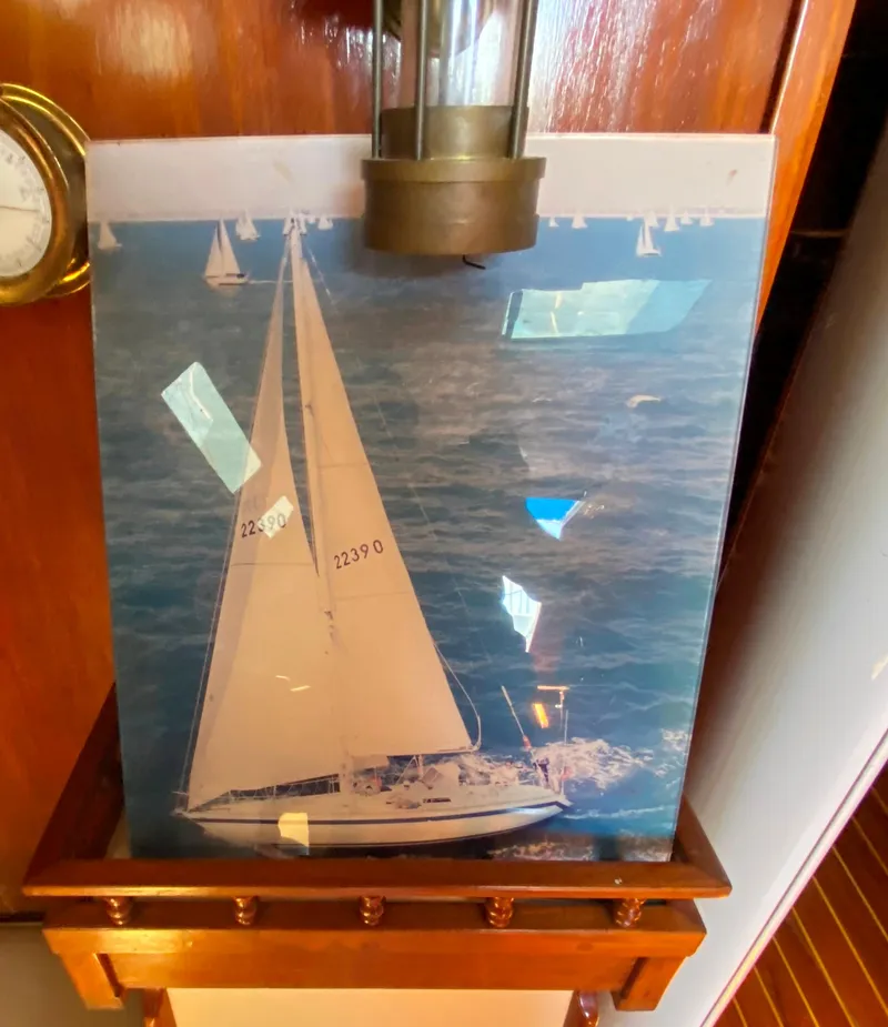 Slide: The Image of 1978 Sailboat MSY 38 model photo displayed on a wooden shelf. - 24