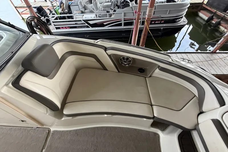 Slide: The Image of 2015 Yamaha Boats 242 Limited S interior seating with beige upholstery and speaker system. - 22