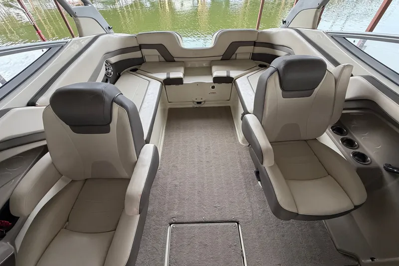 Slide: The Image of Interior of a 2015 Yamaha Boats 242 Limited S, featuring plush seating and elegant design. - 20