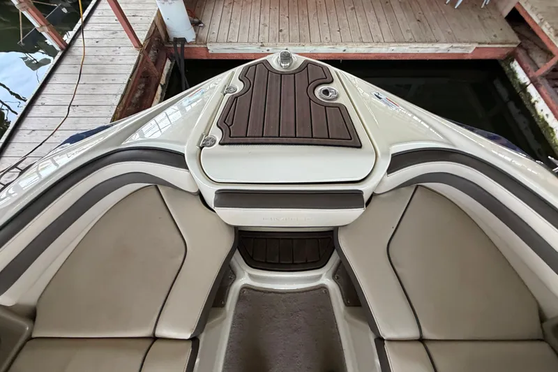 Slide: The Image of 2015 Yamaha Boats 242 Limited S bow seating area with elegant upholstery and wood accents. - 23