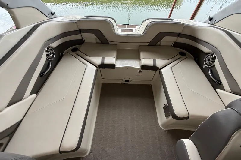 Slide: The Image of Interior seating of 2015 Yamaha Boats 242 Limited S, featuring spacious, cushioned layout. - 13