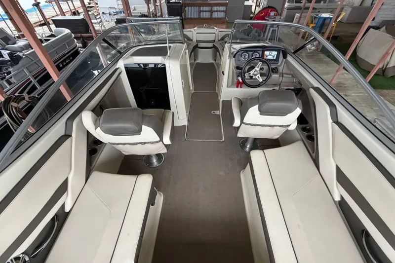 Slide: The Image of 2015 Yamaha Boats 242 Limited S interior with seating and steering console. - 8