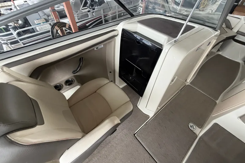 Slide: The Image of Interior of 2015 Yamaha Boats 242 Limited S, featuring seating and storage area. - 15